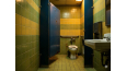 Older public restroom that is not likely to be ADA compliant.