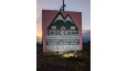 The main sign for Base Camp Family Campground in Alamosa, Colorado.